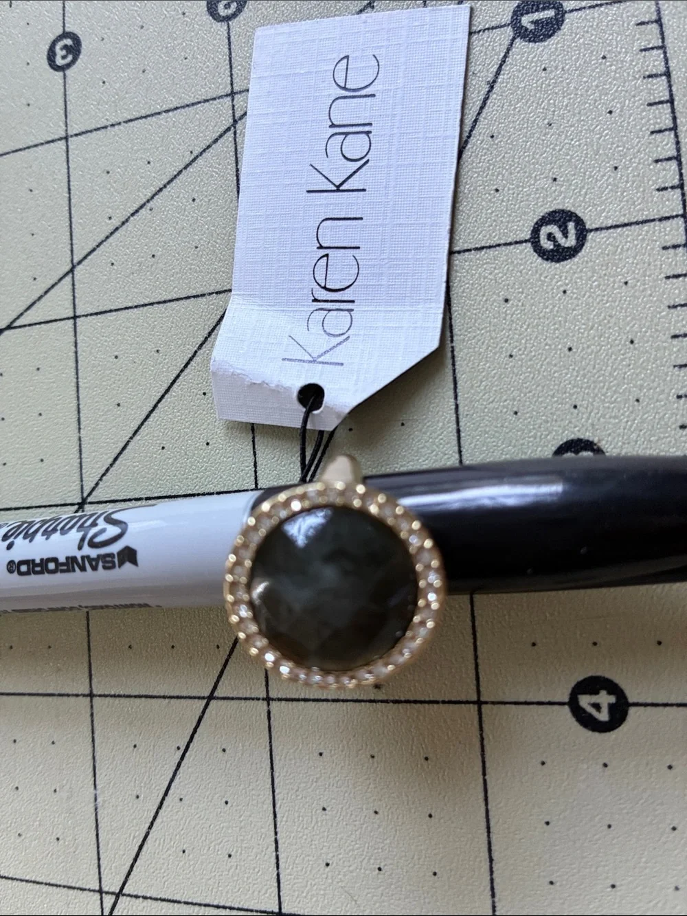 Karen Kane Gold-Tone Ring with Dark Gray Stone and Crystal Halo Costume jewelry